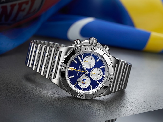 The Chronomat B01 42 NFL Los Angeles Rams Edition with a blue dial and stainless steel straps.