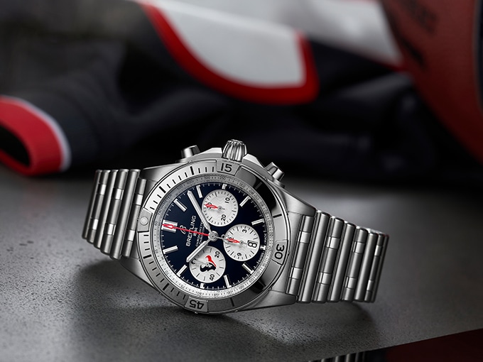 The Chronomat B01 42 NFL Houston Texans Editions, with a dark blue dial and a stainless steel strap.