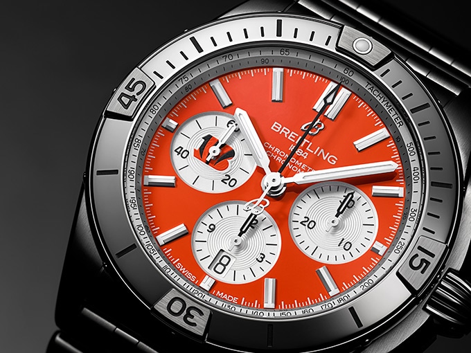 The Chronomat B01 42 NFL Cincinnati Bengals Edition, with a bright red dial and stainless steel case.