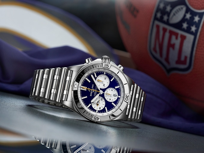 The Chronomat B01 42 NFL Baltimore Ravens Edition, with a dark blue dial and stainless steel straps.