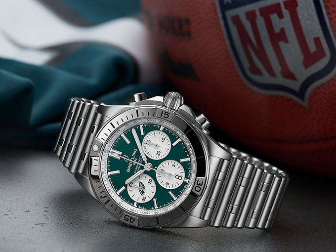 The Chronomat B01 42 NFL Philadelphia Eagles Edition with a silver strap and green dial.