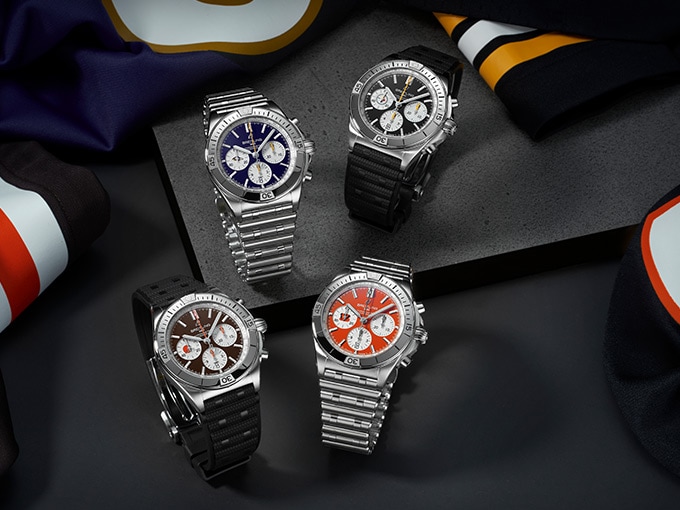 The four watches of the AFC North collection, with different coloured dials and different straps.